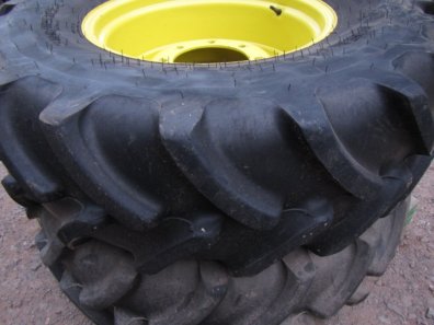 2x 14.9/24 Firestone tyres, fitted to John Deere adjustable wheel