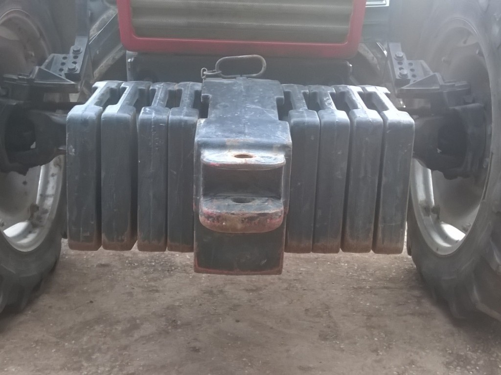 Case tractor weights, 8 wafer weights, plus 1 hitch weight