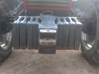 Case tractor weights, 8 wafer weights, plus 1 hitch weight
