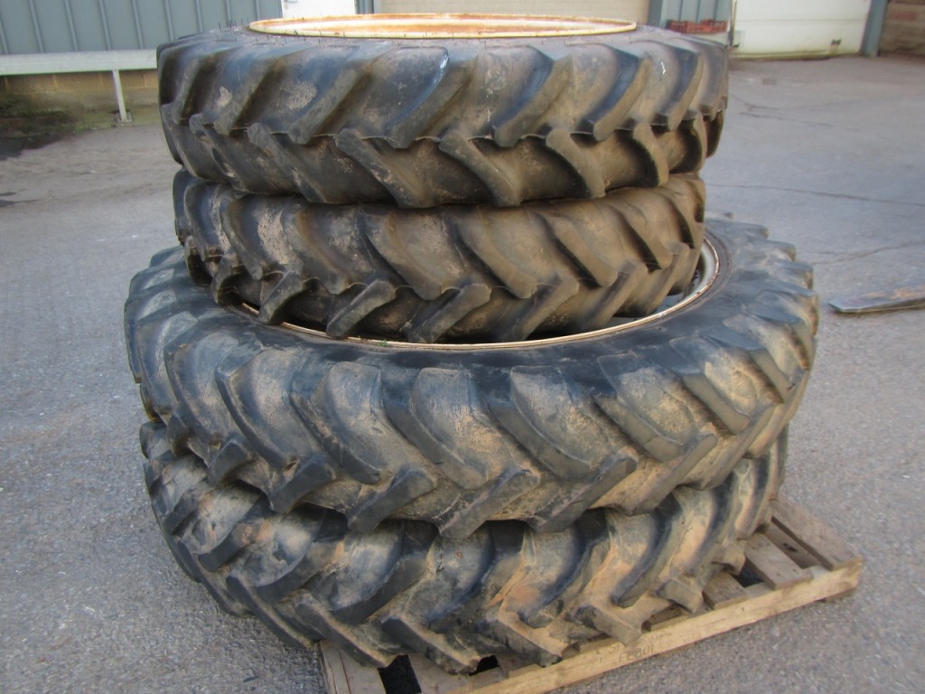 12.4/46 + 11.2/32 row crop tyres fitted to New Holland wheels, to fit a NH TS115