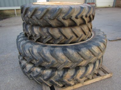 12.4/46 + 11.2/32 row crop tyres fitted to New Holland wheels, to fit a NH TS115