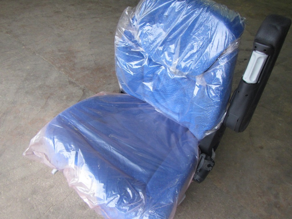 New Holland Tractor seat, New, Air sprung, Complete with left hand arm rest, Manufactured by Grammer