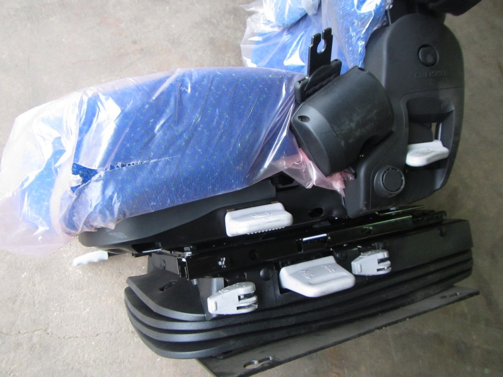 New Holland Tractor seat, New, Air sprung, Complete with left hand arm rest, Manufactured by Grammer
