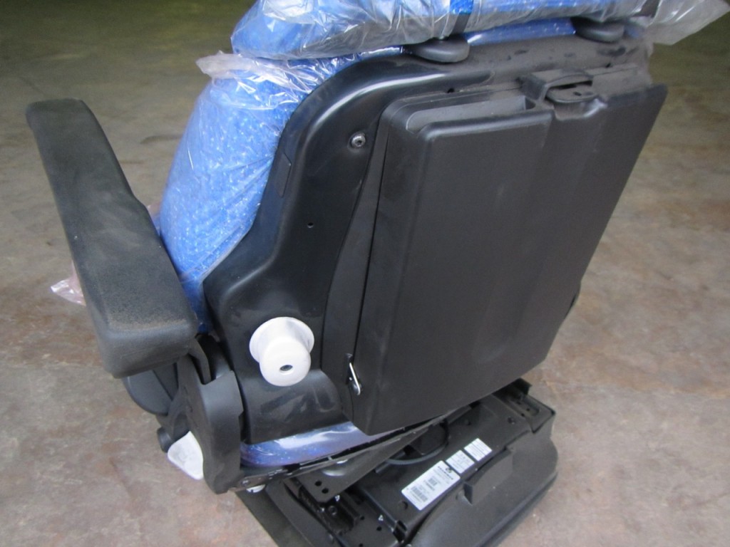 New Holland Tractor seat, New, Air sprung, Complete with left hand arm rest, Manufactured by Grammer