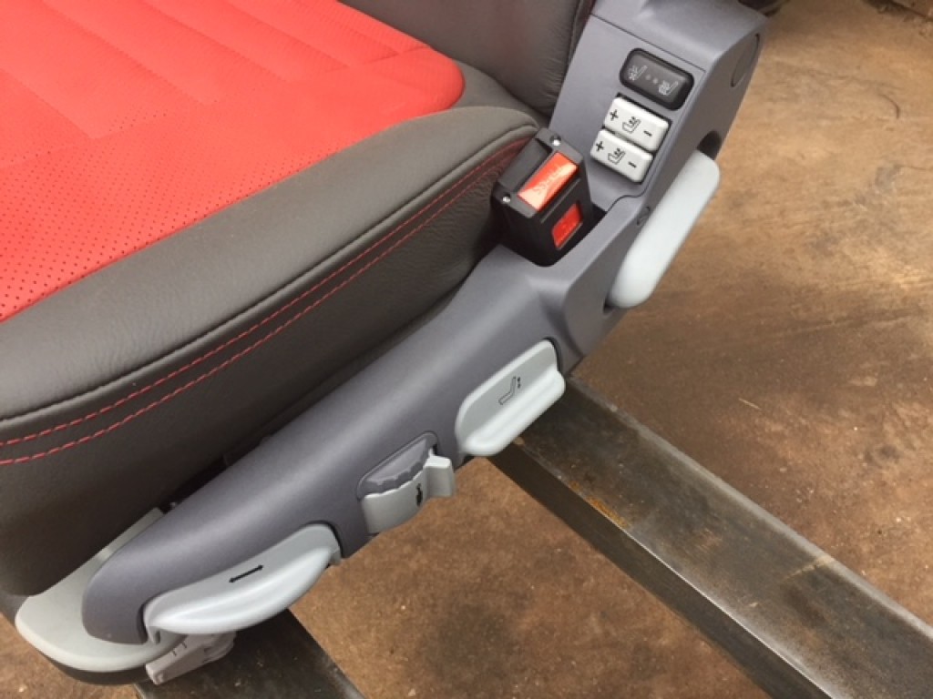 new Case Evolution tractor seat, air sprung, red/grey leather, telescopic headrest, heating switches, complete with left hand armrest, manufactured by Grammer