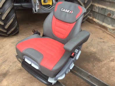 new Case Evolution tractor seat, air sprung, red/grey leather, telescopic headrest, heating switches, complete with left hand armrest, manufactured by Grammer