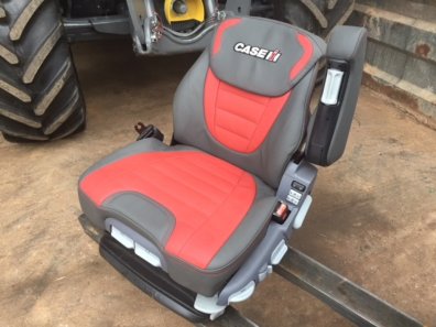 new Case Evolution tractor seat, air sprung, red/grey leather, telescopic headrest, heating switches, complete with left hand armrest, manufactured by Grammer